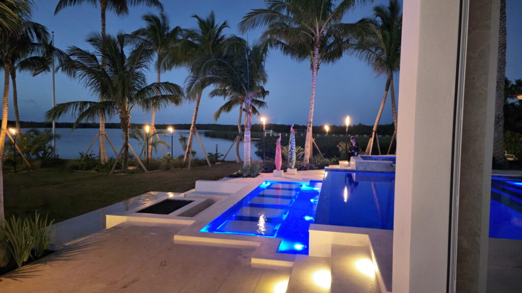 gas lit torches by a pool